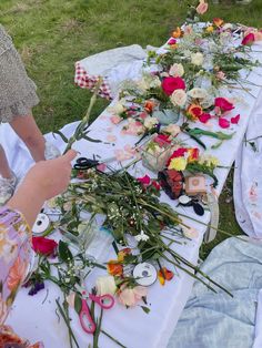 flowers are laid out on a long table