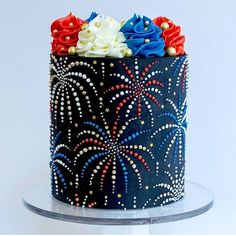 a decorated cake with red, white and blue frosting