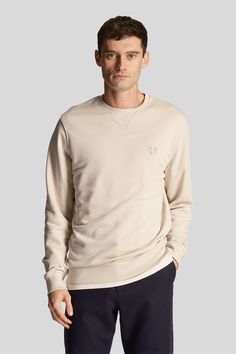 Perfect for teaming with jeans, chinos or shorts and made from 100% cotton, the Tonal Eagle Crew Neck Sweatshirt is a refined take on our essentials range. 100% cotton. Ribbed cuffs, collar and hem. Set-in sleeves. 320 gsm loopback fabric. Tonal Lyle & Scott logo. Machine washable. 100% Cotton. Crew Neck Sweatshirt Men, Polo Rugby Shirt, Sweat Top, Cream Colour, Lyle Scott, Denim Coat Jacket, Loungewear Shorts, Wide Fit Boots, Cargo Trousers