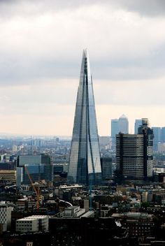 an aerial view of the shardle building in london, with other skyscrapers behind it