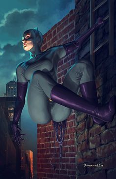 a woman dressed as catwoman hanging off the side of a building