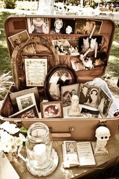 an open suitcase filled with photos and pictures