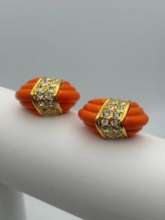 A striking pair of vintage KJL clip on earrings. Excellent vintage condition, with all crystals present and no notable imperfections. Signed KJL. 3.4cm x 1.8cm.  -------------------- 🌟 P&P: 👉 Will arrive gift wrapped in a padded bag. 👉 UK shipping: Royal Mail Tracked 24 👉 International Shipping: Royal Mail International Tracked -------------------- 💎 FOLLOW US:  👉 www.instagram.com/janedreamsofvintage 👉 www.facebook.com/JaneDreamsOfVintage Elegant Orange Clip-on Earrings, Formal Orange Clip-on Earrings, Orange Clip-on Earrings For Formal Occasions, Vintage Orange Clip-on Earrings, Padded Bag, Pad Bag, Vintage Orange, 80s Vintage, Kenneth Jay Lane