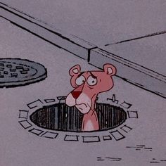 a cartoon bear in the middle of a sewer