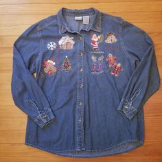 * Bobbie Brooks * Women's XL (16-18) * 100% Cotton * Blue Jean Denim * Button Down Front * Christmas Themed Embroidery Patches * Long Sleeves Measurements taken with item laid flat and are approx. Bust 23.25 in / 59 cm Length 29 in / 74 cm Sleeve Length 22.5 in / 57 cm No stains or holes.  denim, jean, christmas, embroidery, vintage, 90s, holiday, santa clause, gingerbread men, teddy bear, tree, mittens, ice skates, bells, holly, mistletoe, shacket, over shirt, chambray Christmas Button Up Shirt, Santa Embroidery, Vintage 90s Dress, Embroidered Bird, Bobbie Brooks, Holiday Tops, Denim Button Down, Sweaters And Jeans, Embroidery Patches