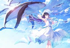 a woman in a white dress is standing next to a whale and some birds flying above her