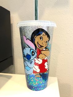 a plastic cup with an image of cartoon characters on it