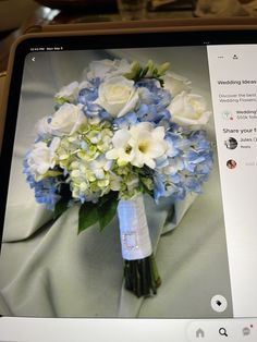 a bridal bouquet with blue and white flowers