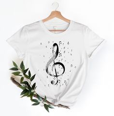 Music Note Shirt, Music Lover Shirt, Musical Gift, Music Tees, Personalized Gifts, Spring Shirts, Casual Wear, Graphic T Shirts, Music Shirt Black design for Athletic Heather, White, Baby Blue, Pink, Orange, Heather Peach, Yellow, Banana Cream, and Desert Pink. White design for all other colors Premium quality printed in the USA. Free Shipping on orders over $35 (US only) Printed in the USA High quality, durable shirts, sweatshirts, hoodies etc. A B O U T U S We offers custom t-shirts for any oc Music Shirts Design, Music Tee Shirts, Show Choir Shirts Design, Tshirt Print Ideas Graphic Tees, Choir Shirts Design, Music Shirt Design, Cricket Shirts, Choir Shirts, Handmade Comb