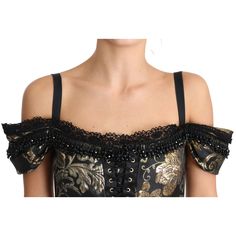 Indulge in the epitome of luxury with this striking Dolce & Gabbana blouse. Immaculately new with tags, this top exudes elegance with its black gold floral jacquard design, richly complemented by opulent black crystal embellishments. A classic spaghetti strap design with a sleek zipper closure is perfect for a statement evening look. Lovingly fashioned in Italy, this blouse is a testament to high fashion and superior craftsmanship. Material: 34% Polyester, 28% Acetate, 16% Metal Fiber, 10% Silk, Luxury Elegant Tops With Crystal Embellishments, Luxury Jacquard Elegant Tops, Luxury Sleek Spaghetti Strap Tops, Luxury Embellished Black Blouse, Luxury Elegant Baroque Print Blouse, Crystal Blouse, Spaghetti Strap Blouses, Jacquard Blouse, Spaghetti Strap Top