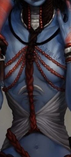 a woman with blue skin and braids on her face