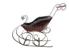 a brown wicker baby's carriage with wheels