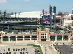 an aerial view of a baseball stadium with cars parked in the parking lot