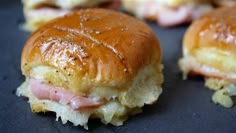 ham and cheese sliders on a black plate