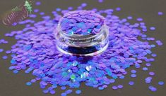 purple and blue confetti sprinkles in a glass jar