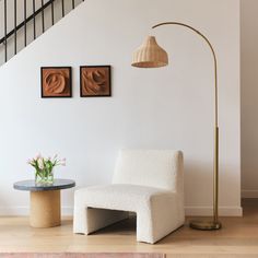 Meet Lark, an LED Floor Lamp with a unique arc and a flair for style: With a stunning brass finish from the base to the stem and a wicker hanging shade, the Lark brings both warmth and flexibility to your home. The Lark stands at 75 in tall, featuring a rattan bell shade that's 13 in in diameter and 9.5 in tall as well as a heavy weighted base that's 12 in in diameter to prevent the lamp from tipping. We proudly stand behind all of our products 100% and offer a full 3 year warranty, covering the product if it stops working within 3 years of your purchase or if there are any defects within those 3 years. Brightech 75-in Antique Brass Arc Floor Lamp | FL-LRK-BRS Beachy Living Room Ideas, Beachy Living Room, Tall Lamp, Stylish Floor Lamp, Boho Floor, Rattan Shades, Floor Lamp With Shelves, Tall Lamps, Arc Lamp