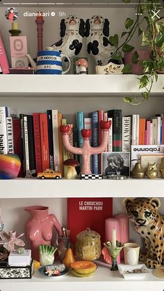 the shelves are filled with books, vases and figurines on top of them