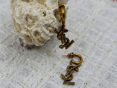 YSL Gold Metal Earrings Size : 3.8 cm/ 1.5 in Signed Saint Laurent Paris No box Ysl Earrings Logo, Ysl Gold, Ysl Vintage Jewelry, Yves Saint Laurent Vintage Jewelry, Luxury Vintage Green Clip-on Earrings, Bronze Serpent, Vintage Ysl, Saint Laurent Paris, Studs Earrings