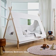 a child's bedroom with a tent bed in the middle