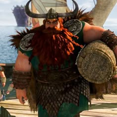 a man dressed as a viking standing on a dock