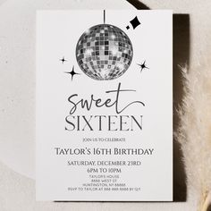 a white party card with a disco ball on it and the words sweet sixteen written in black