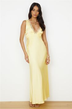 Your dreams can become your reality once you step out and follow your heart. The Dreaming Desire Maxi Dress in Yellow is a wondering addition to any wardrobe. Style with simple black kitten heels and small hoops for a romantic and comfortable look.   Maxi dress, true to size Plunge neckline with lace trim  Lace detailing on dress and detail on back  Invisible zipper on side  Lined bust  100% Polyester  Non-stretch fabric Please refer to the care label on your garment for specific instructions on how to care for it Model wears XS Length from shoulder to hem: 147cm on an S Chest 36cm, Waist 34cm, size 8 Pale Yellow Bridesmaids Dresses, Fashion Wedding Guest, Spring Break Dress, Bandeau Maxi Dress, Black Kitten Heels, White Slip Dress, Off Shoulder Dresses, Cocktail Dress Formal, Crop Dress