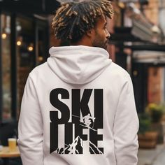 Stay cozy and stylish this winter season with our ski life hoodie! This unisex sweatshirt is the perfect gift for skiers and nature lovers alike. Embrace the ski life and stay warm with this mountain hoodie, featuring a spacious kangaroo pocket and a hood to keep you comfy and warm during all your après ski adventures. Adventure awaits with this y2k-inspired, cozy and stylish sweatshirt for all your winter sports activities. Embrace the winter games in style with our ski sweatshirt! This comfy unisex hoodie is the ideal nature lover gift for anyone who loves the great outdoors. Whether hitting the slopes or lounging by the fire, this sweatshirt is your go-to for warmth and comfort.   .: Made with a medium-heavy fabric (8.0 oz/yd² (271 g/m that consists of 50% cotton and 50% polyester for t Urban Hoodie With Letter Print For Outdoors, Urban Hoodie With Graphic Print For Outdoor, Urban Graphic Print Hoodie For Outdoor Wear, Winter Hoodie With Logo Print, Winter Outdoor Sportswear Hoodie, Winter Hoodie For Outdoor Activities, Crew Neck, Casual Sweatshirt With Drawstring Hood For Winter Sports, Urban Hoodie With Letter Print For Outdoor Activities, Sporty Winter Hoodie With Logo Print