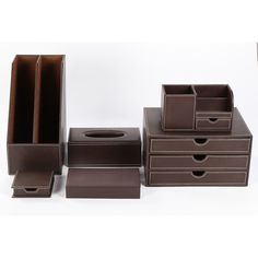 four brown drawers and one tissue dispenser