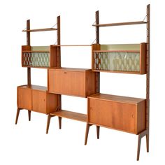 two wooden shelves with glass doors and drawers on each shelf, against a white background