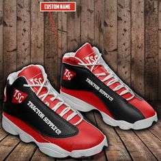 a pair of red and black sneakers with the words custom name on them, sitting on a wooden floor