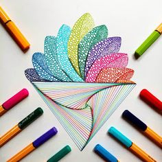 an instagram photo with markers and crayons on the bottom right corner, next to it is a colorful paper flower