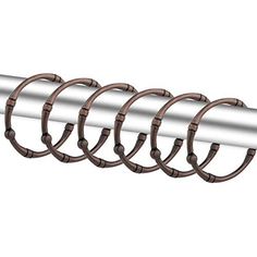 a metal tube with four rings on it