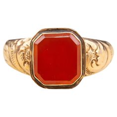 A large antique English Georgian era gentleman’s gold signet ring, circa 1830. In the centre there is a flat-cut and bezel-set octagonal carnelian gemstone. These stones in these types of rings would typically be engraved with a coat of arms or family crest and then pressed into hot wax to seal letters and deeds. Remarkably however, this one has survived 200 years without being engraved - a real rarity! The gold mount is hollow in construction, typical of the period and is crafted in 9K gold. Th Seal Ring, Georgian Era, Gold Signet Ring, Ring Displays, Work Design, In Construction, Family Crest, Antique Jewellery, Types Of Rings