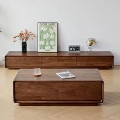 two wooden coffee tables sitting on top of a hard wood floor