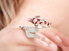 🐟 Dive into elegance with our Creative Red Koi Fish Ring! This unique handmade piece is perfect for adding a splash of color to your daily outfits or dancing the night away at parties. 💃✨ Features: Handmade Beauty: Crafted with care, each ring tells its own story! 🎨 Adjustable Fit: Easily resize for the perfect comfort on your finger! 🔄 Stylish Accessory: Ideal for daily wear, dance parties, or any chic event! 🎉 Durable Materials: Made from high-quality brass and vibrant epoxy for long-lasting wear! 💪 Lightweight Design: Weighing just 2.7g, it's effortless to wear all day! 💫 Perfect for girls and women who love unique, creative accessories. A fabulous gift for fashion-forward friends! 🎁💍 Red Koi Fish, Fish Ring, Christmas Ring, Dance Parties, Creative Accessories, Handmade Beauty Products, Dance Party, Koi Fish, Ring For Women