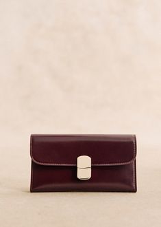 Made in our Italian atelier;Smooth leather exterior;Leather lining;Metal clasp with light gold finish;Zipped pocket and patch pocket inside. Patch pocket on back.;Weight: 160 g / 5.6 oz;Dimensions: 9 x 2.5 x 16 cm / 3.5 x 1 x 6.3 in Lifestyle Dresses, Suit Shoes, Large Wallet, Basket Bag, Best Bags, Summer Accessories, Small Leather Goods, Parisian Style, Large Bags