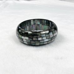 One piece of Black Mother Of Pearl Mosaic Bangle. ･ ｡ﾟ☆: *.☽ .* :☆ﾟ. Handmade Bangle Materials: Black Mother Of Pearl, Resin Chain style: Mosaic Adjustable length: No Can be personalized: Yes Made to Order (Timeframe depends on quantity) ･ ｡ﾟ☆: *.☽ .* :☆ﾟ. Shop Link: www.etsy.com/shop/taichungjewelleryH Black Jubilee Bracelet Bangle As Gift, Black Jubilee Style Bangle Bracelet, Black Round Cuff Bracelet Gift, Elegant Handmade Black Bangle, Modern Black Bangle, Modern Black Round Bangle, Black Jubilee Bangle Bracelet, Black Jubilee Bracelet Bangle, Handmade Black Round Bangle