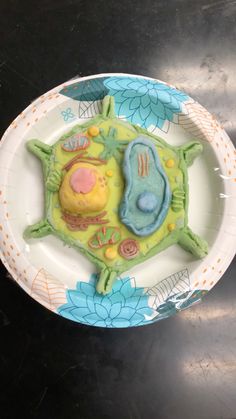 a plate that has some kind of food on it with flowers and leaves around it