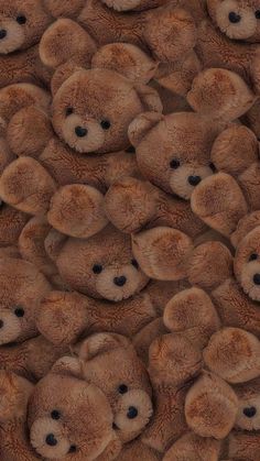 a large group of brown teddy bears sitting together