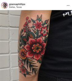 a person with a flower tattoo on their arm