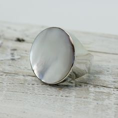 "Elegant white Mother of pearl round ring set on 925 sterling silver with a gorgeous genuine white mop cap quality jewelry solid quality work Dimensions Length x Width : 26 x 26 mm Weight 12.3 grams Colors : WHITE PEARL MOP RING SIZING is available if you need a bigger or smaller size choose option \"Ring + Resizing\" and put option in message box.  For resizing it takes 5 to 7 days before shipping / $20 usd done by laser" Elegant Round Mother Of Pearl Ring, White Mother Of Pearl Wedding Ring, Classic Mother Of Pearl Ring As A Gift, Classic Mother Of Pearl Ring For Gift, Classic Mother Of Pearl Ring As Gift, Wedding Pearl Ring In Mother Of Pearl, Wedding Pearl Ring With Mother Of Pearl, Elegant White Mother Of Pearl Ring, White Mother Of Pearl Round Pearl Ring