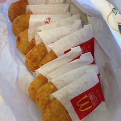 some chicken nuggets are lined up in paper bags