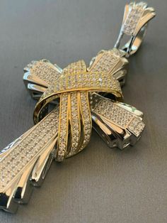 "Men's Custom Made Super Iced Out HEAVY Cross Pendant! Solid 925 sterling silver We have 3 styles! Rhodium finished, two-toned, & 14k yellow gold finished! Color lasts many years!! Measures roughly 2.5\" by 1.5\" ..weighs roughly 25 grams 200 micropaved handset simulated diamonds (CZ) for a total of 3ct! 100% 925 silver...not plated or filled...will NEVER TARNISH OR CHANGE COLOR LISTING IS FOR PENDANT ONLY, CHAIN NOT INCLUDED Bale fits most chains up to 8mm thick!" Luxury Silver Cross Jewelry, Luxury Cross Jewelry For Anniversary, White Gold Diamond Jewelry With Shiny Finish, Silver Cross Jewelry With 17 Jewels, Luxury Sterling Silver Cross Pendant Jewelry, Luxury Sterling Silver Cross Jewelry, White Gold Polished Cross Jewelry, Luxury Diamond Cut Cross Jewelry, White Gold Cross Jewelry With Polished Finish