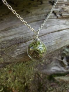 This teeny tiny round glass pendant is filled with real moss! Take a piece of the forest everywhere with you. The ball is about half an inch across. The moss is preserved so it will stay green and lush.  It comes on a nickel- free silver chain with a lobster clasp. Enchanted Necklace Aesthetic, Goblincore Necklace, Therian Clothes, Trinket Trading, Moss Crafts, Goblincore Jewelry, Moss Jewelry, Moss Necklace, Forest Jewelry