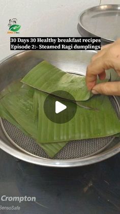 a person cutting up some food in a pan