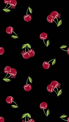 cherries and leaves on a black background seamless pattern for wallpaper or fabric