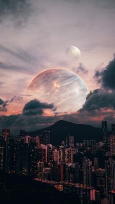 an image of two planets in the sky over a city at night with mountains and clouds