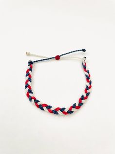 This fun patriotic braided bracelet is waterproof and adjustable! It is perfect for any 4th of July Party! It would also make a nice gift. Stack it with other bracelets, or wear it by itself! ∙ ∙ ∙ ∙ ∙ ∙ ∙ ∙ ∙ ∙ ∙ ∙ ✦ PLEASE NOTE ✦ When you first receive this bracelet, it may feel slightly waxy, which may make it more difficult to adjust. The waxy texture does not last. After a day or two of wearing, the waxy texture will fade, and it will be much easier to adjust. It will still be waterproof an Adjustable Patriotic Friendship Bracelets As Gifts, Patriotic Blue Bracelets For Beach, Blue Friendship Bracelets For 4th Of July Gift, Handmade Adjustable Patriotic Bracelets, Blue Adjustable Bracelets For 4th Of July, Adjustable Beach Bracelets For 4th Of July, Adjustable Bracelets For Beach And 4th Of July, Adjustable Friendship Bracelets For 4th Of July, Patriotic Handmade Adjustable Bracelets