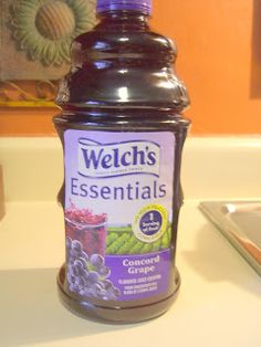 a bottle of juice sitting on top of a counter