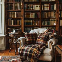 a living room filled with furniture and lots of bookshelves full of bookcases